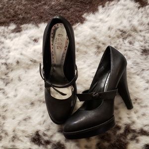 Vintage black leather BCBG platform heels.